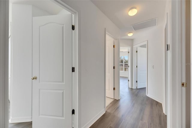 hallway featuring dark hardwood / wood-style floors