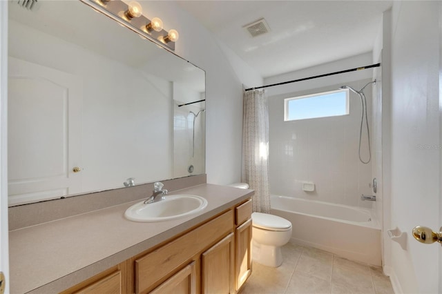 full bathroom featuring tile patterned floors, shower / tub combo with curtain, vanity, and toilet