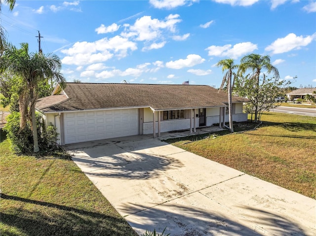 ranch-style home with a front lawn, a porch, and a garage