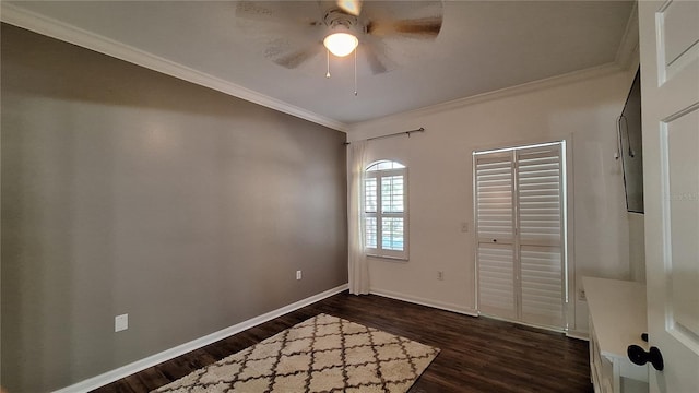 interior space featuring dark hardwood / wood-style floors, ceiling fan, and crown molding