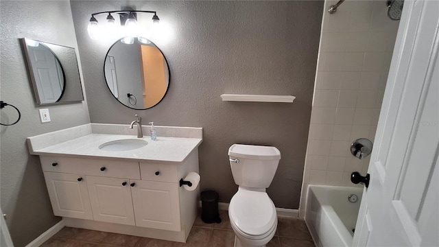 full bathroom with tile patterned flooring, vanity, toilet, and tiled shower / bath combo