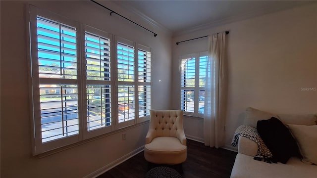 living area featuring dark hardwood / wood-style floors and ornamental molding