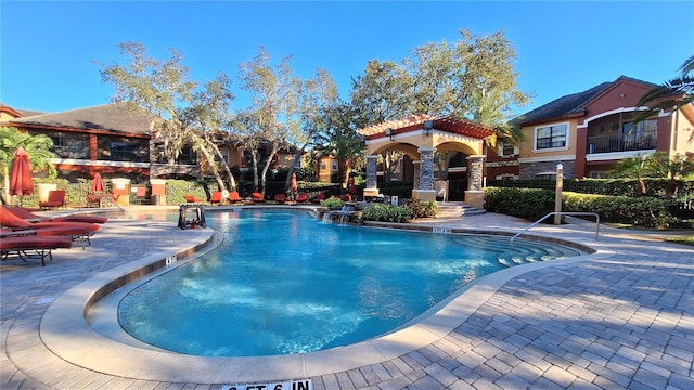 view of swimming pool with a patio area