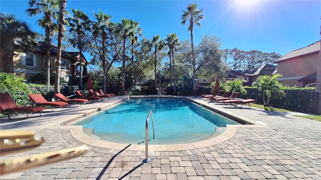 view of swimming pool with a patio