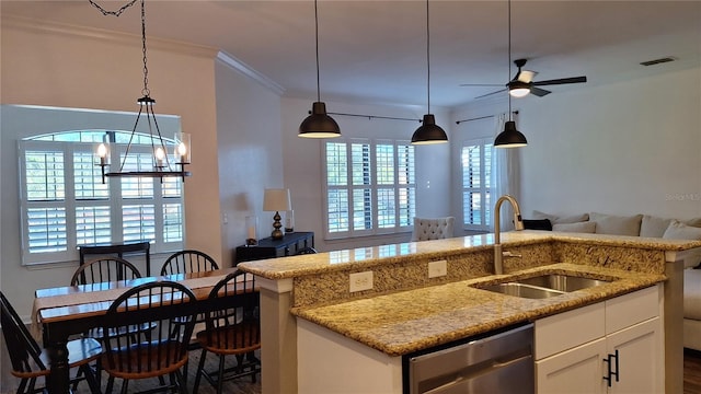 kitchen featuring white cabinetry, sink, dishwasher, and light stone countertops