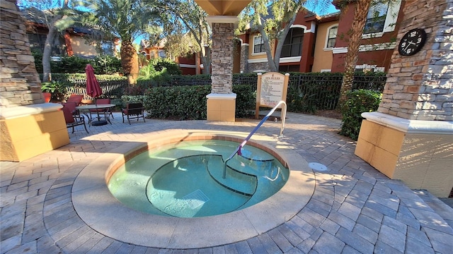 view of patio / terrace with a hot tub