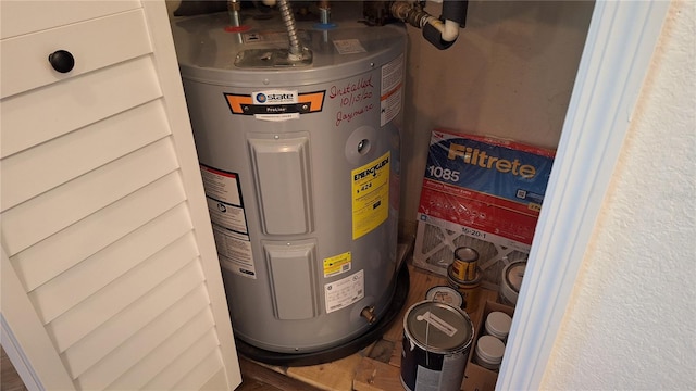 utility room with water heater