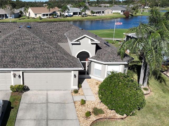 birds eye view of property with a water view