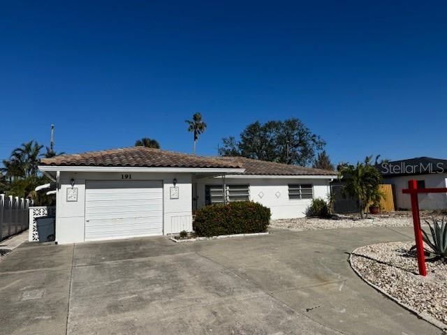 single story home with a garage