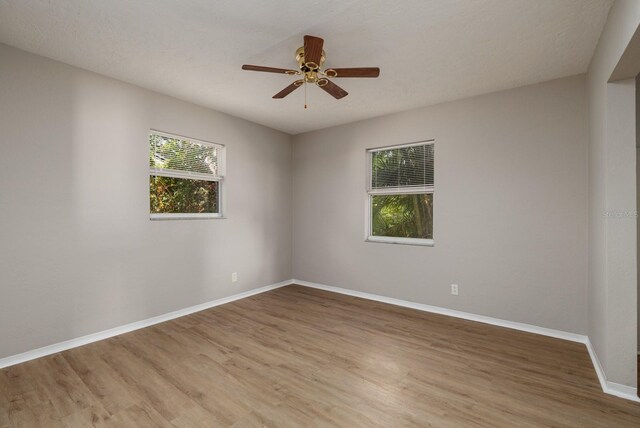 spare room featuring ceiling fan and wood-type flooring