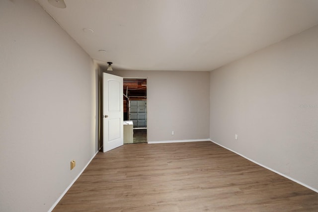 unfurnished room featuring light hardwood / wood-style floors