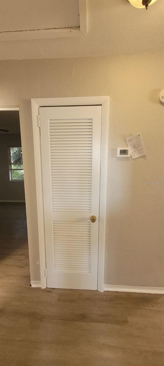 interior details featuring hardwood / wood-style flooring