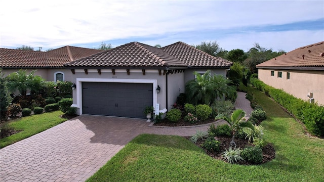 view of side of home featuring a lawn and a garage