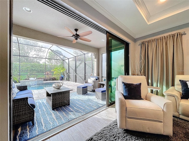 sunroom / solarium with a pool and ceiling fan