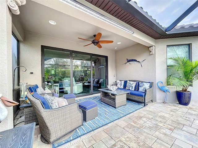 view of patio / terrace featuring ceiling fan and an outdoor living space