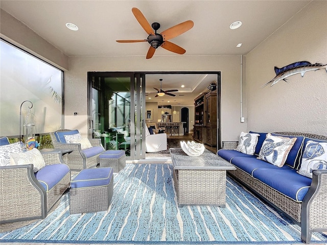 view of patio featuring outdoor lounge area and ceiling fan