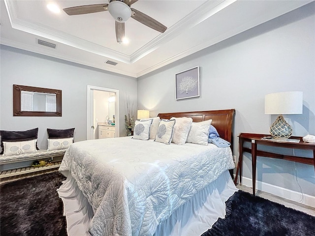 bedroom featuring ceiling fan, a raised ceiling, and crown molding