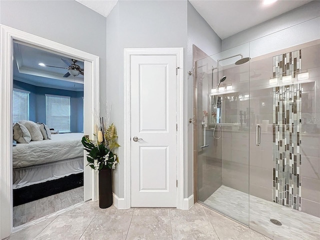 bathroom featuring tile patterned flooring, an enclosed shower, and ceiling fan