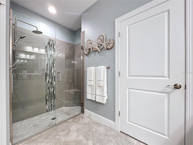 bathroom featuring tile patterned flooring and an enclosed shower