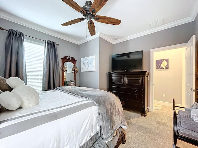 carpeted bedroom featuring ceiling fan and ornamental molding