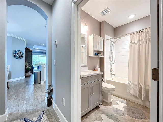 full bathroom with shower / bath combination with curtain, vanity, wood-type flooring, and toilet