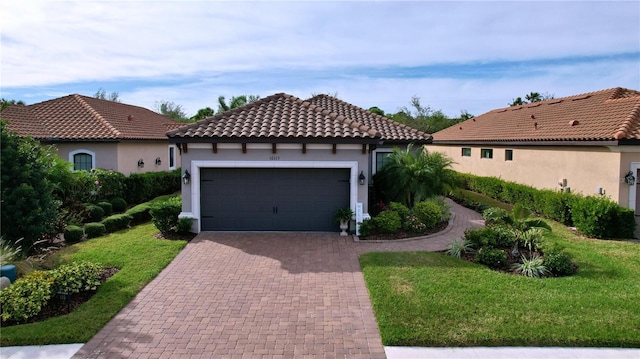 mediterranean / spanish-style house with a front yard and a garage