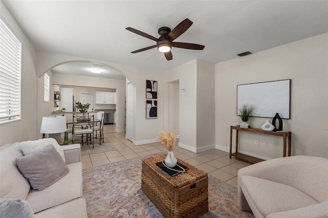 living room featuring ceiling fan and light tile patterned floors