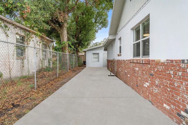 view of side of property featuring a patio area