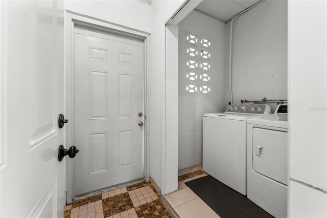 laundry area featuring washing machine and clothes dryer