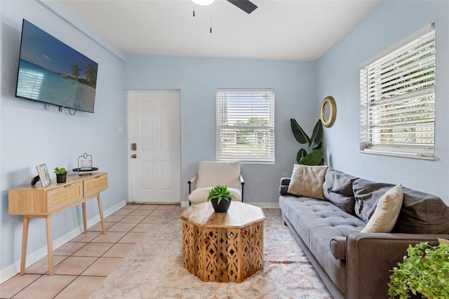 tiled living room with plenty of natural light and ceiling fan