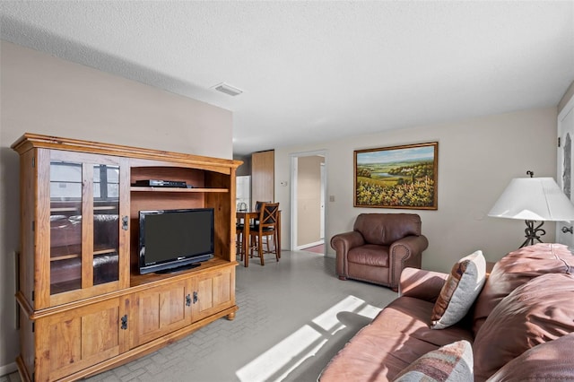 living room with a textured ceiling