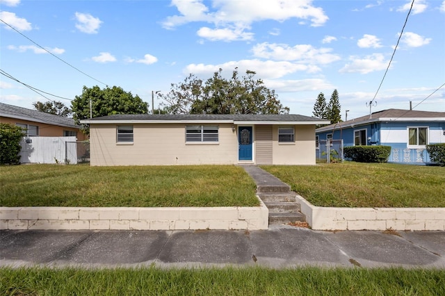 single story home featuring a front lawn