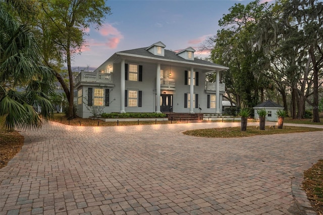 neoclassical / greek revival house with a balcony