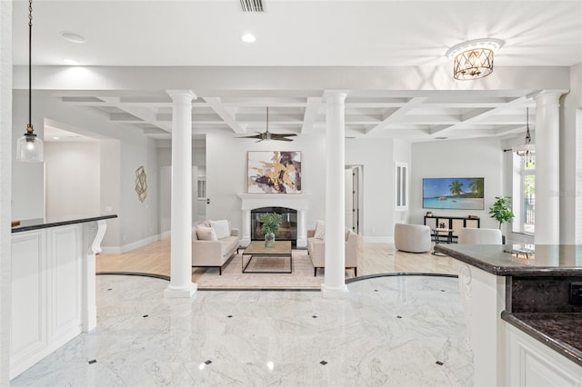 unfurnished living room with beamed ceiling, light hardwood / wood-style floors, and coffered ceiling