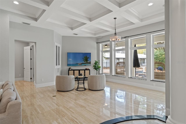 living room featuring beamed ceiling, coffered ceiling, and a notable chandelier