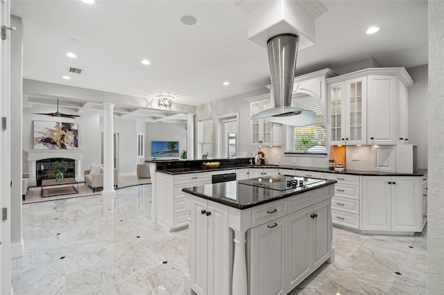 kitchen with white cabinetry, a center island, sink, kitchen peninsula, and black electric stovetop