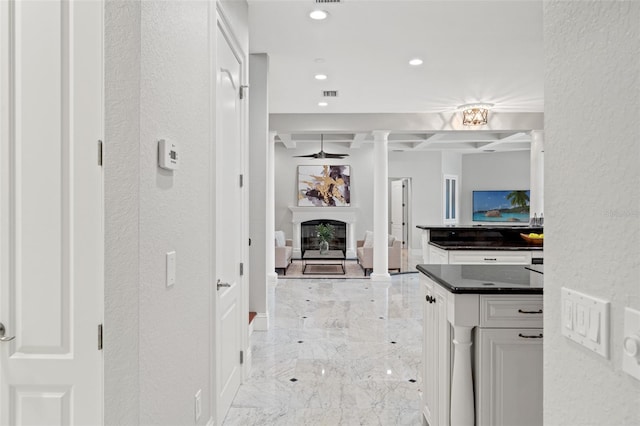 hallway featuring decorative columns