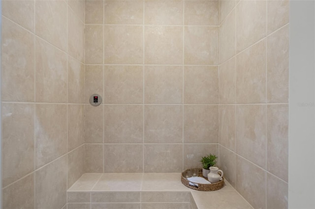 bathroom with tiled shower