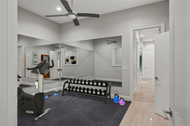 workout room with hardwood / wood-style flooring and ceiling fan