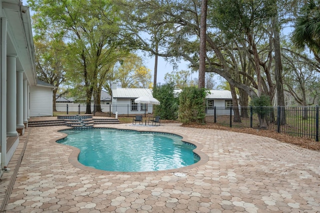 view of pool featuring a patio area