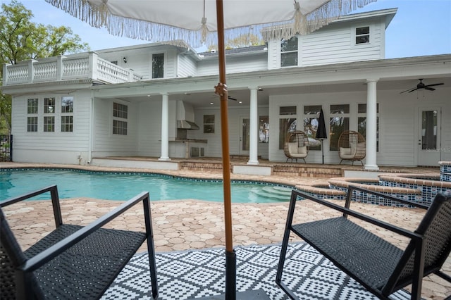 view of pool featuring ceiling fan and a patio area