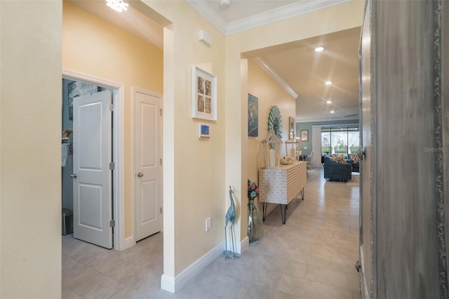 hallway with light tile patterned floors and ornamental molding