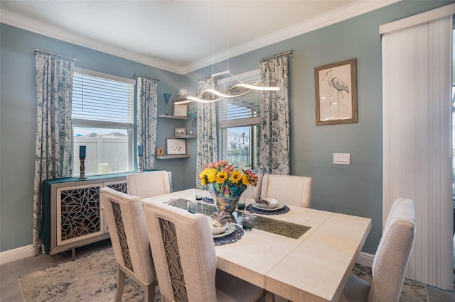 dining space featuring tile patterned floors, crown molding, and an inviting chandelier