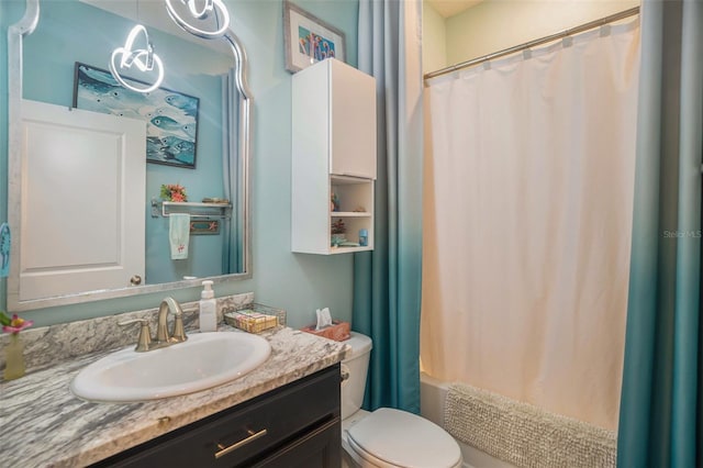 full bathroom featuring vanity, toilet, and shower / bath combo with shower curtain