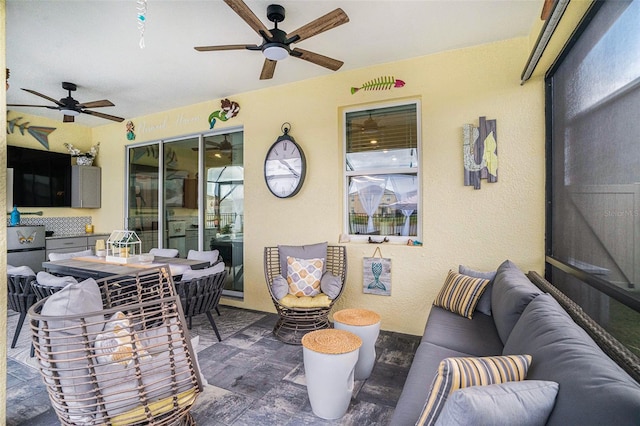 view of patio featuring an outdoor hangout area and ceiling fan