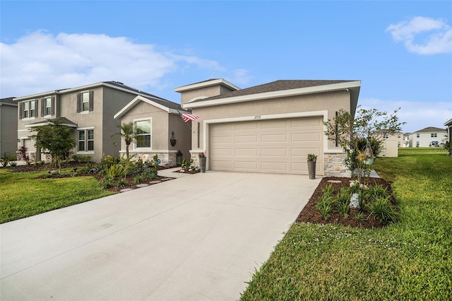 view of front of home featuring a front lawn and a garage