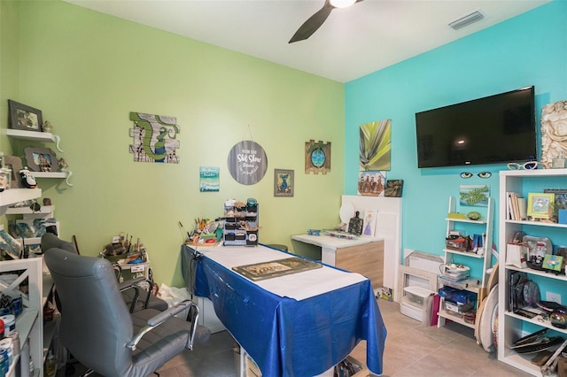 office space featuring ceiling fan and light tile patterned floors