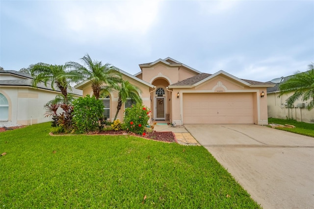 view of front of property featuring a garage and a front yard