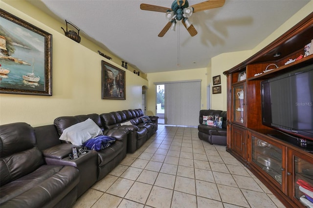 tiled living room featuring a textured ceiling and ceiling fan