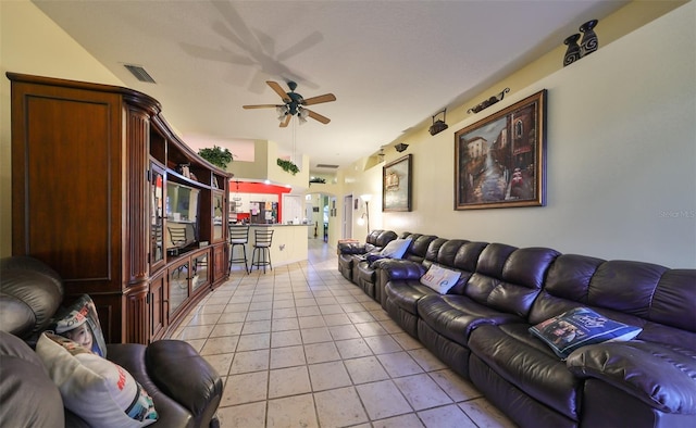 tiled living room featuring ceiling fan